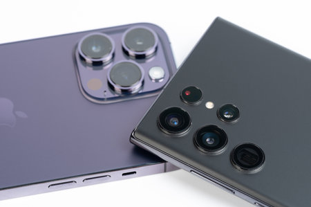 New york, USA - November 8, 2022: Apple iphone 14 pro max  and samsung s22 ultra smartphone camera corporationのeditorial素材