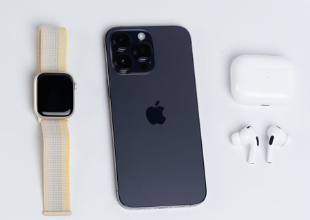 New york, USA - November 8, 2022: Apple smart devices iphone, watch and earphones lay on white...