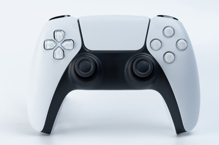 Black and white modern game controller with sticks isolated on studio backgroundの写真素材