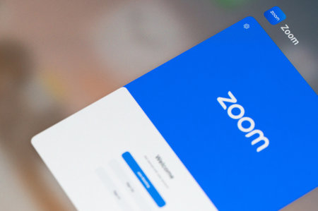 New york, USA - January 23, 2022: Zoom application for mobile device  screen close up view backgroundのeditorial素材
