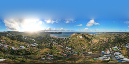360 vr aerial drone panorama of San Juan Del Sur  on bright  sunset golden lightの写真素材