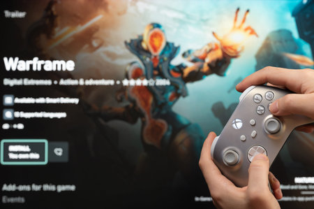 New york, USA - February 20, 2023: Gamer start new Warframe Game on xbox console with joystick in...