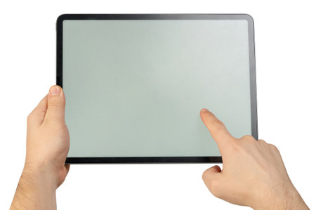 Touching screen  on tablet with one finger close up view isolatedの写真素材