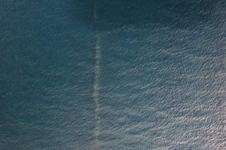 Deep blue sea water texture wide drone above view