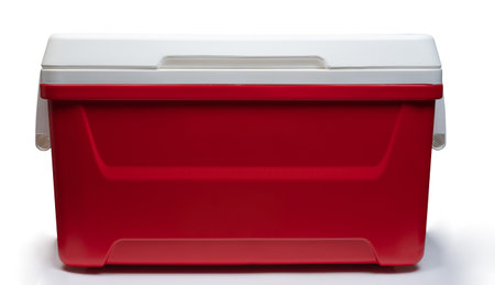 Closed red  plastic thermo refrigerator  front view isolated on white studio backgroundの写真素材