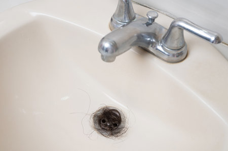 Blocked sewage sink in bathroom macro close up viewの写真素材