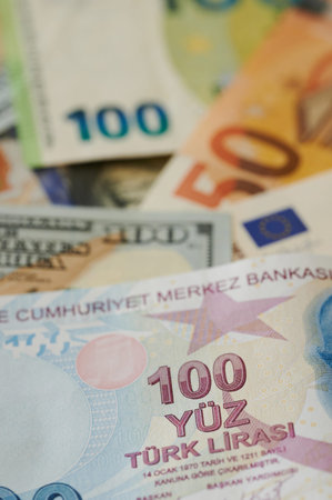 100 turkish lira on us and Eu currency background. Turk money theme