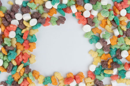 Colorful cornflakes frame with empty space in middle