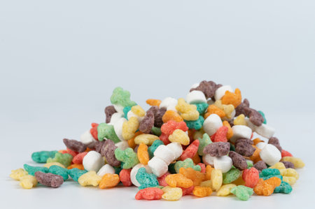 Pile of sweet cornflakes isolated on white studio backgroundの写真素材