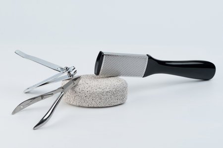 Set for men pedicure tools of scissors,scrub for feet isolated on white studio backgroundの写真素材