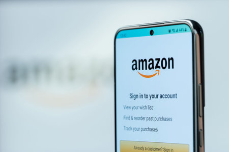 New York, USA - August 20, 2023: Working on smartphone using amazon app on smartphone screen close...