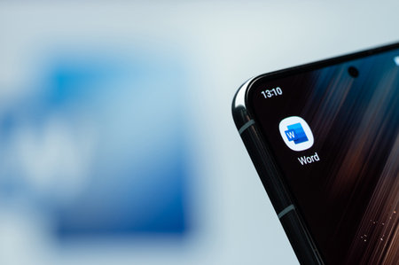 New York, USA - August 21, 2023: Using Microsoft office word app  on smartphone screen close up with blurred logo backgroundのeditorial素材