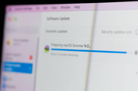 New York, USA - September 28, 2023: Updating Apple laptop system to macOS Sonoma 14 on pixel screen...