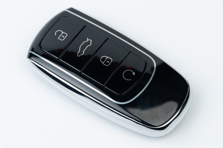 Electronic car key black color perspective view isolated on white studio backgroundの写真素材