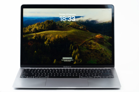 New York, USA - September 28, 2023: Macbook air with Sonoma OS new system stand on white studio backgroundのeditorial素材
