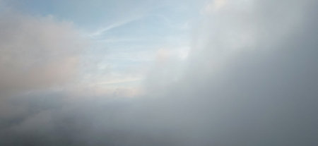 Fluffy soft clouds close up view on sky background