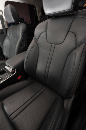 Clean black leather car driver comfortable chair close up viewの写真素材