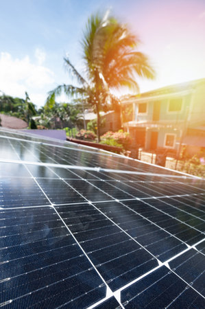 Solar electricity supply theme. Sunlight hit Soalr panels on roofの写真素材