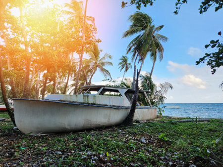 Abounded sea boat on beach island side viewの写真素材