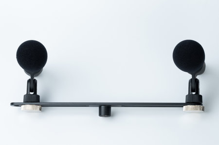 Stereo pair microphone on metal bar isolated on white studio backgroundの写真素材