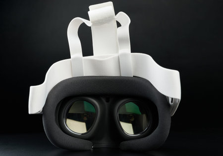 Lens on VR headset isolated on black studio background