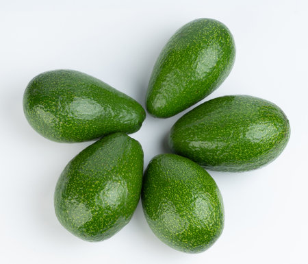 Group of avocados above top view isolated on white studio backgroundの写真素材