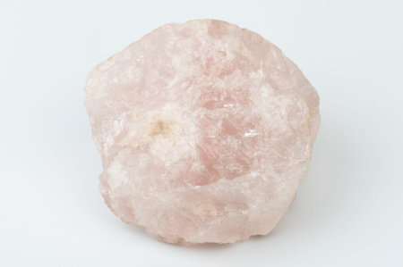 Pink color mineral gem rock stone isolated on white studio background