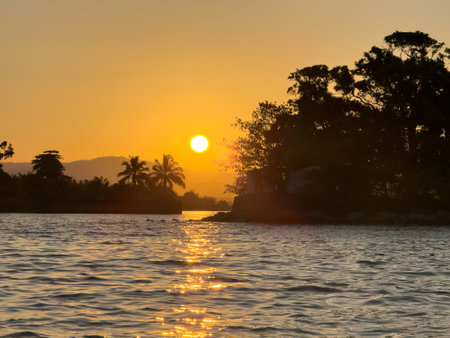 Silhouette of tropical islands in sunset light colorsの写真素材
