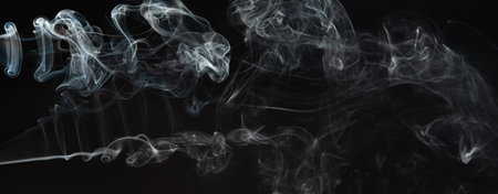 Smoke curly waves on black studio backgroundの写真素材
