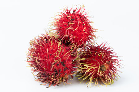 Close up of group rambutan fruits isolated on white studio backgroundの写真素材