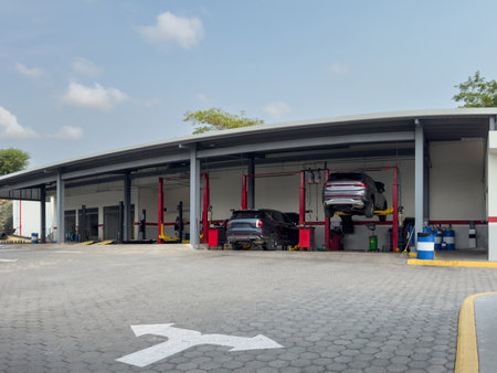 Car maintenance station with lift on blue sky backgroundの写真素材