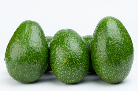 Set of green avocado fruits isolated on white studio backgroundの写真素材