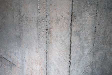 Flat concrete surface with lines of extra material close up view