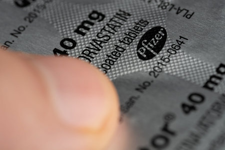 New York, USA - May 31, 2024: Pfizer pills in box silver package macro close up view