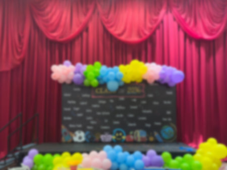 Event stage with red velvet cloth blurred backgroundの写真素材