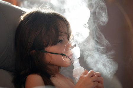 Breath kid therapy with inhaler mask close up portrait
