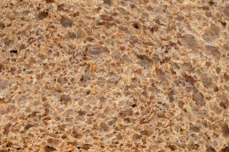 Whole wheat slice bread texture background macro close up view