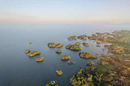 Lake coast landscape with islands aerial drone view on sunset timeの写真素材