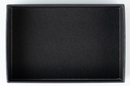 Black paper box above top view isolated on white studio backgroundの写真素材