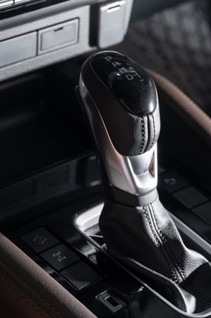Automatic gearstick with leather cover macro close up view