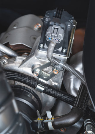 Car turbo part connection in modern engine close up view