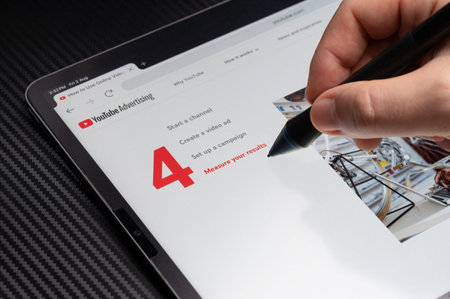 New York, USA - August 2, 2024: Measure results of youtube advertising on tablet screen macro close...