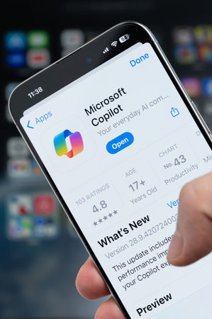 New York, USA - August 5, 2024: Smartphone in hand with Microsoft copilot app on screen macro close up view with blur backgroundのeditorial素材