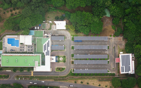 Hotel rooftop with big pool and parking with solar panel aerial drone top view