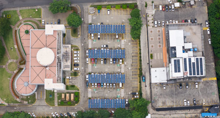 Big parking lot with solar panel roof ar residential district aerial drone view