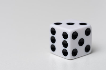 White cube dice macro close up view on studio backgroundの写真素材