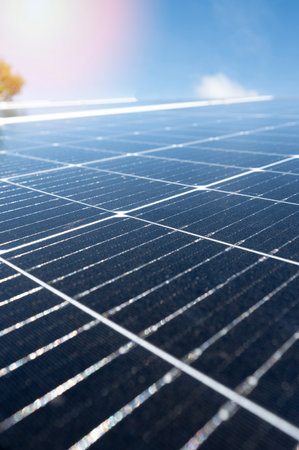 Solar panel surface close up view on blue sunny sky backgroundの写真素材