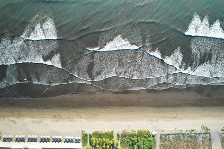 People on ocean beach aerial drone top above view on sunset timeの写真素材