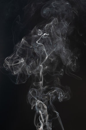 Transparent white smoke cloud isolated on black studio backgroundの写真素材