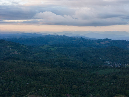 Breathtaking view of verdant mountains under cloudy sky as dusk approaches in Nicaragua, offering tranquil atmosphere.の写真素材